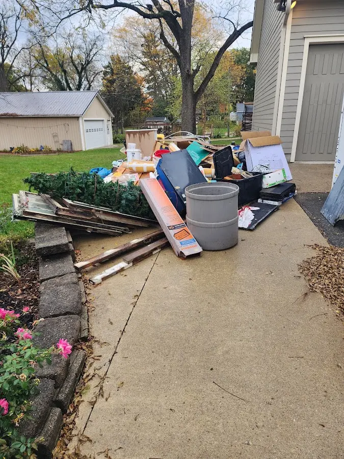 Dumpster being loaded with debris for 30 Yard Dumpster Rental in Shirley